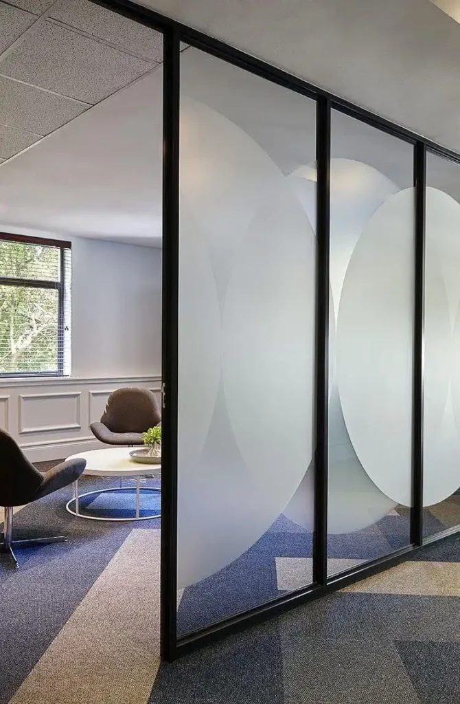 frosted glass film partition at a coworking space installed by signboards